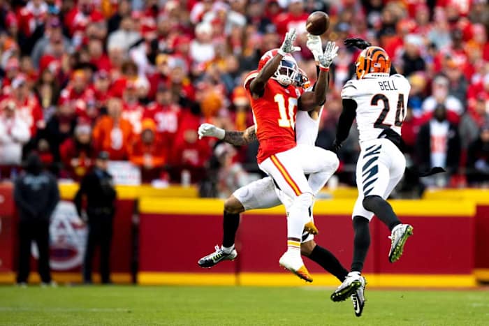 Cincinnati Bengals free safety Jessie Bates (30) knocks the ball away from Kansas City Chiefs wide receiver Tyreek Hill (10) and Cincinnati Bengals safety Vonn Bell (24) intercepts it in overtime of the AFC championship NFL football game, Sunday, Jan. 30, 2022, at GEHA Field at Arrowhead Stadium in Kansas City, Mo. Cincinnati Bengals defeated Kansas City Chiefs 27-24. Cincinnati Bengals At Kansas City Chiefs Jan 30 Afc Championship 103